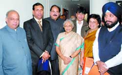 Chief Minister Sheila Dikshit along with her new cabinet ministers Mangat Ram Singhal, Raj Kumar Chauhan, A K Walia, Haroon Yusuf, Kiran Walia and Arvinder Singh Lovely pose for a group photograph in New Delhi 