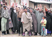 Protesters shout anti-election slogans in Anantnag on Wednesday.