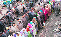 Enthusiastic villagers await their turn at a Kokarnag polling station.