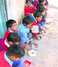 Students of government school eat their midday meal