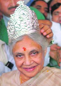 CROWNING GLORY: Delhi Chief Minister Sheila Dikshit being felicitated by her supporters after the oath-taking ceremony