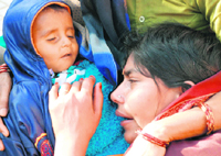 Inconsolable mother of 11-month-old Kuldeep with his body at Mohali civil hospital on Thursday.