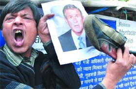 An activist under the banner of Foundation of Common Man protests against the detention of Iraqi TV reporter Muntadhar-al-Zeidi, who who threw a shoe on US President George W. Bush, at Jantar Mantar in New Delhi