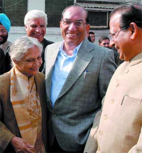 Chief Minister Sheila Dikshit with leader of opposition V.K. Malhotra and Jagdish Mukhi outside the Delhi Vihan Sabha
