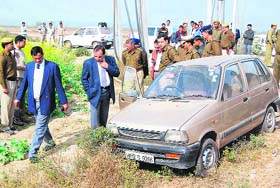 The police examines the spot in the Daulatabad area where Rajiv was allegedly killed in an encounter with the Gurgaon police