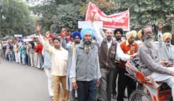 Members of the All India Grameen Dak Sewak Union, Bathinda, taking out a peaceful protest rally in the city