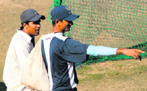 A player from the city get tips from the Indian bowling coach, Venkatesh Prasad.