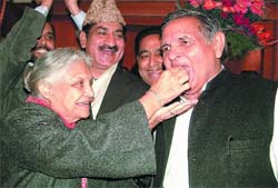 Chief Minister Sheila Dikshit offers a sweet to the newly elected Speaker, Yoganand Shastri, in New Delhi on Friday. 