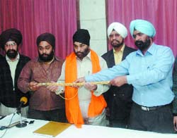Chairman of the Shiromani Akali Dal (Khalsa) welcomes the newly appointed secretary general of the party at a press conference in New Delhi on Friday