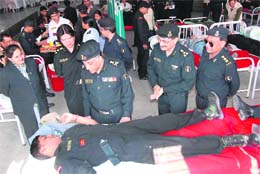 Black cat commandos of the NSG donate blood at a blood donation camp organised in Gurgaon on Thursday.
