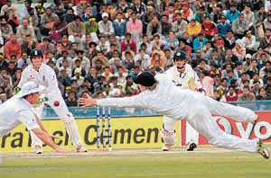 THE ONE THAT GOT AWAY: A Rahul Dravid snick sails through two English fielders on the opening day of the second Test in Mohali on Friday. After a series of low scores, Dravid was 65 not out when stumps were drawn. India were 179 for 1 on a day interrupted by bad light and rain. 