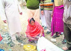 A woman sells fish at Chandi Ghat in Haridwar. 