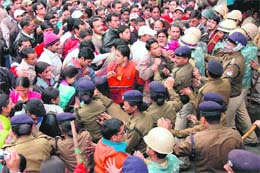 Schoolteachers court arrest in Dehradun on Saturday. 