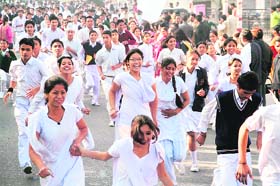 Schoolchildren participate in a Run against Terror in Dehradun