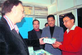 Suryakant Dhasmana distributes free glucometers at a health camp organised by Doon Diabetics Association at Dehradun