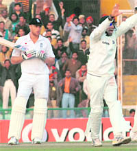 VVS Laxman appeals for the wicket of Andrew Flintoff (L) during the third day of the second Test  at the PCA Stadium in Mohali on Sunday.