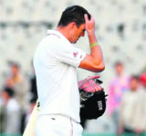 Kevin Pietersen walks back to the pavillion after being dismissed at Mohali.