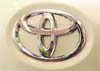 This file photo shows a Toyota Motor logo on a car in Osaka. Hit by declining sales and soaring yen, Toyota Motor said on Monday it was expecting to post its first-ever operating loss in 71 years, at 150 billion yen for the fiscal 2009.  AFP