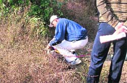 A member of the forensic team collects evidence relating to the rape of a minor in Mukhali