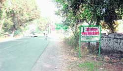 A hoarding displaying the name of the Rania-Kariwala road as Satguru Partap Singh Marg
