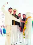 NSG commando Rajesh Kumar garlands the statue of Sir Chhotu Ram at Bahadurgarh 
