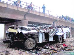 The mangled remains of the ill-fated bus.