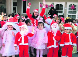 Students of St Xavier Playway School celebrate Christmas in Ludhiana on Monday.
