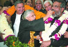 Chief Minister Sheila Dikshit offers sweets to Ambrish Singh Gautam, who was elected deputy speaker of the Delhi assembly