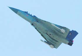 A Light Combat Aircraft flies during the celebration of HAL Day in Bangalore