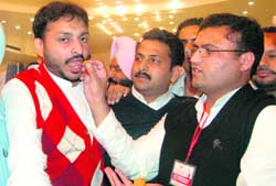 Ashok Tanwar, president, All-India Youth Congress, offers sweets to Ravneet Singh Bittu in Amritsar 