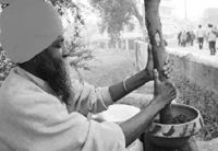 A man sells bhang ki thandai at Jor Mela on Wednesday.