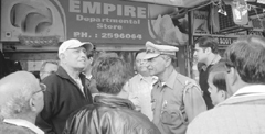 Shopkeepers argue with HUDA and police officials at Sector 7 market in Panchkula on Wednesday.