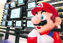 This file photo shows Japanese video game giant Nintendo's game character Super Mario standing at a showroom in Tokyo. Nintendo Co. said on Thursday it would start offering videos through its blockbuster Wii game console, the latest new feature for the Japanese entertainment giant.