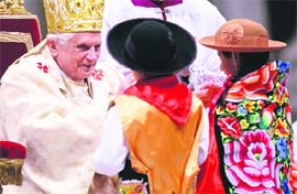 Children bring offerings as Pope Benedict XVI leads the Christmas mass in Saint Peter's Basilica at the Vatican on Wednesday.