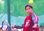 A player in action during the quarterfinals of the YMCA Total Tennis Championship in Chandigarh on Friday.