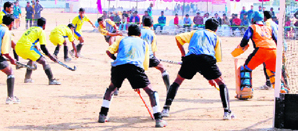 Players slug it out during a match at Gurukul University in Haridwar on Friday.