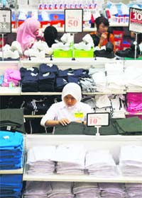 A woman shops at a mall in Kajang outside Kuala Lumpur