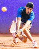 A palyer returns a shot in the Junior National Soft Tennis Championship in Chandigarh