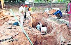 Labourers repair the pipeline supplying water to the Nehru building at PGI 
