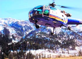 A helicopter takes off with tourists at Kothi village, 13 km from Manali, on the Manali-Rohtang highway