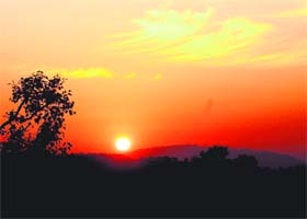 Sun rises above Dhauladhar mountains