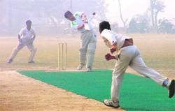 A match between the Neva Club and Nav Bharti School in progress during the fifth Sarpanch Bachan Singh Memorial Cricket Tournament being held Balloke