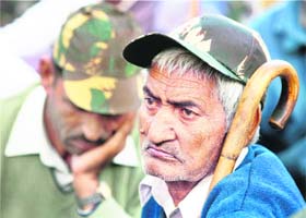 An Ex-serviceman listens to his leader during a dharna against the Sixth Pay Commission at Jantar Mantar in New Delhi