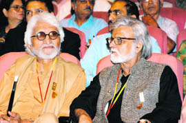 M. F. Husain and Satish Gujral at an awards ceremony. Husain continues to live in exile following threats by some Hindu fundamentalists over his artworks