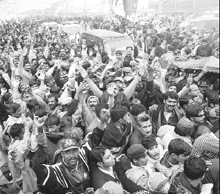 Supporters gather to pray at the grave of their slain leader, former Prime Minister Benazir Bhutto, on her first death anniversary in Garhi Khuda Bakhsh, near Larkana, Pakistan, on Saturday.