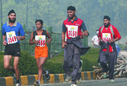 Youngsters participate in the Mawana Sugars Indian Open Marathon in New Delhi on Sunday.