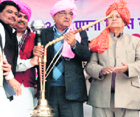 Congress members present a hookah to Chief Minister Bhupinder Singh Hooda at a public rally in Barodap, Sonepat, on Sunday.