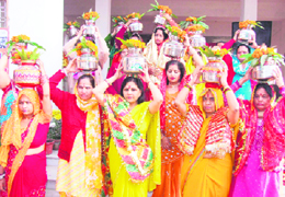 Women take part in a kalash yatra from the Krishna temple, Sector 4, Gurgaon, on Sunday.