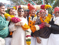 Congress leader Khajan Singh being greeted at Kasan village near Gurgaon during a mahapanchayat on Sunday.