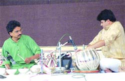 Milind Tulankar plays jaltarang at the Harballabh Sangeet Sammelan in Jalandhar on Saturday. 